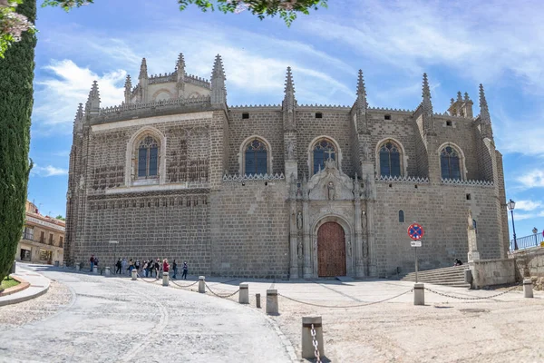 stock image Toledo Spain - 05 12 2021: Exterior panoramic view at the Monastery of Sao Joao dos Reis building or Cofrada Hermandad Cristo de la Humildad, Gothic-Flemish church from 17th century, Toledo, Spain