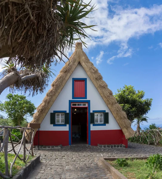 stock image Madeira Island Portugal - 04 19 2023: View of the typical and traditional house on the island of Madeira, a tourist icon in the village of Santana, houses with thatched roof