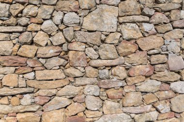 Architecture textures, detailed view of a traditional paired granite masonry, used on a fortress castle wall... clipart