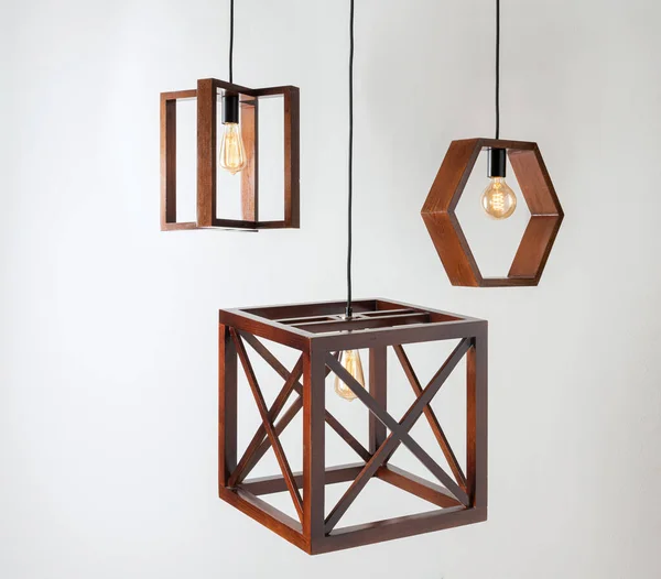 modern geometric wooden lamps, lighting fixtures suspended from the ceiling