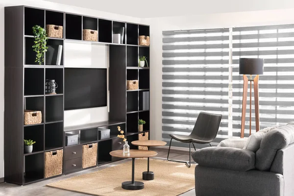 contemporary living room features two large shelves and two comfortable chairs, perfect for relaxation
