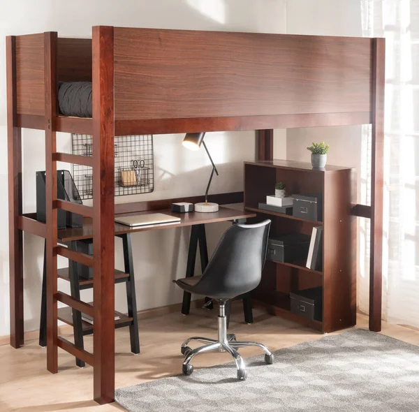 Modern Workspace Bedroom with a Mid-Century Full Loft Bed, Wooden Corner Desk with Storage and Computer, Accented by a Black Office Chair, Against White Walls