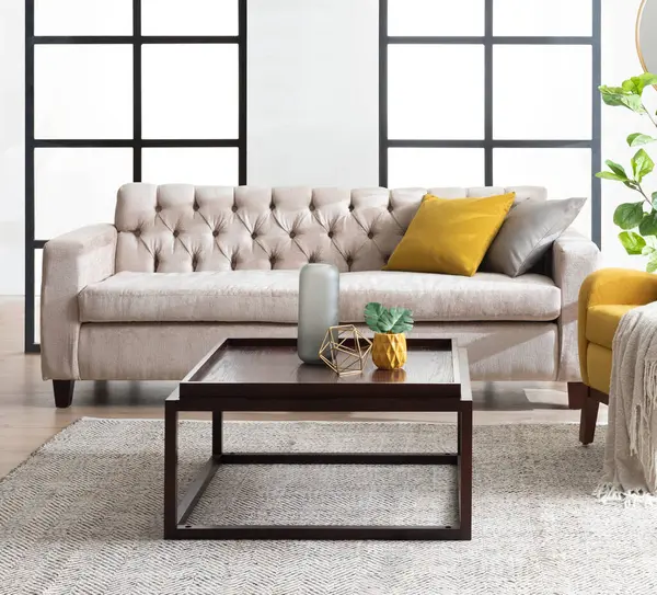 Modern Living Room Interior Featuring a Classic Beige Loveseat Cushion Sofa, Coffee Table, and Plant Pot Decor, with Glass Sliding Barn Doors in the Background