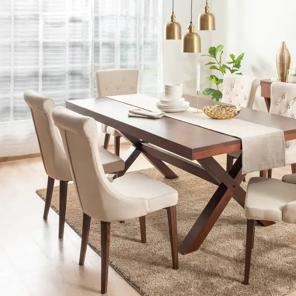 Dining Room with Rectangle Wooden Dining Table Set and Fabric Beige Button Dining Chairs with Wooden Legs, Adorned by Linen Table Runner, White Ceramic Dinnerware Set, and Ornaments on the Table.