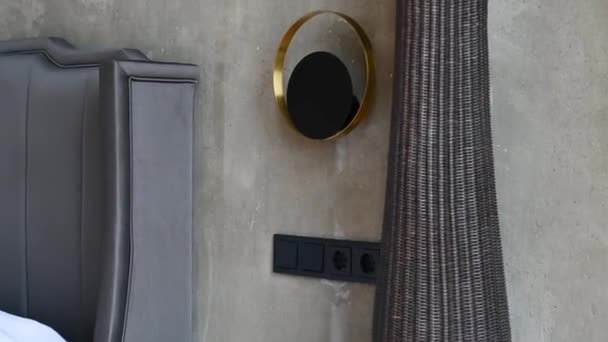 Black Vase Made Metal Placed Hardwood Flooring Next Gray Concrete — Stock Video