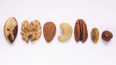 Set of oily dry fruits isolated on white background