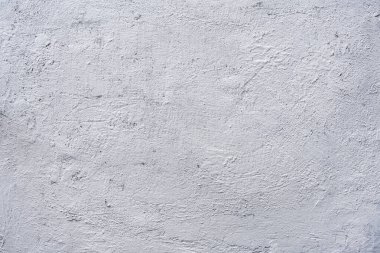 White or gray rough grainy concrete wall texture background.