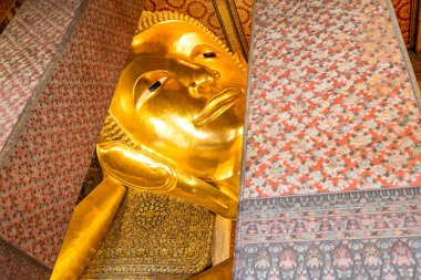 Wat Pho 'nun uzanan Buddha imajı Tayland' ın Bangkok şehrinde bir numaralı turistik ilgi odağı..