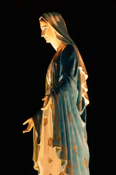 stock image Side view of the Virgin Mary statue at night. Cathedral of the Immaculate Conception, Chanthaburi, Thailand.