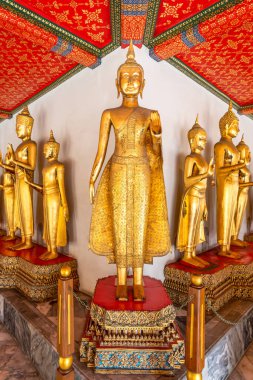 The ancient Buddha image of Wat Pho is a top tourist attraction in Bangkok, Thailand. clipart