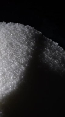 Mountain of white sugar grains. 4K Vertical