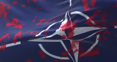 Kanlı ve yazılı NATO Bayrağı. Döngü