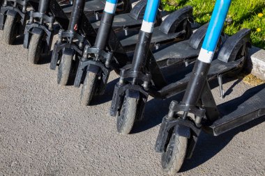 Electric scooters in the parking lot. Scooter rental for a trip around the city.