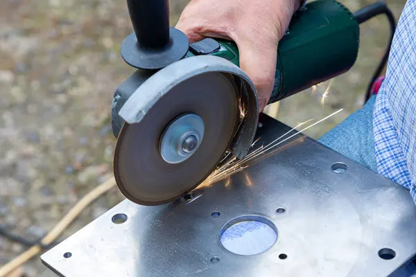 stock image Cutting metal with a grinder. Processing and grinding of metal with sparks