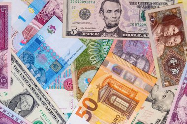 Dünyanın dört bir yanından gelen çeşitli banknotların arkaplanı.