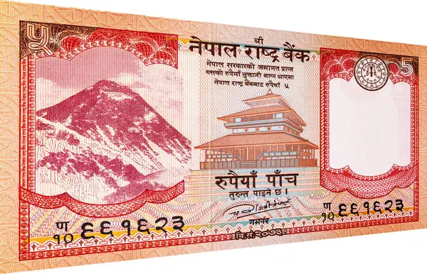 Üzerinde Everest Dağı 'nın resmi olan 5 rupilik Nepal banknotu, tasarım için. Nepal parası