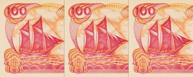 Endonezya 'dan gelen 100 rupiah banknotunun bir parçası, Pinisi Teknesi' ni resmediyor. Endonezya 'dan kağıt para.