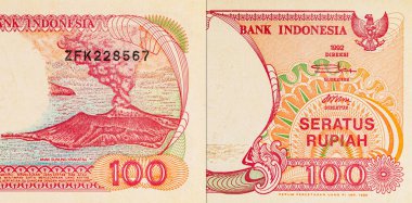 Endonezya 'dan gelen 100 rupiah banknotunun bir parçası, Pinisi Teknesi' ni resmediyor. Endonezya 'dan kağıt para.