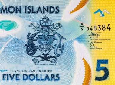 Solomon Adaları 5 Dolar. Polimer banknot parçası 2019 'da çıkarılmış ton balığını gösteriyor. Solomon Adalarının Parası.