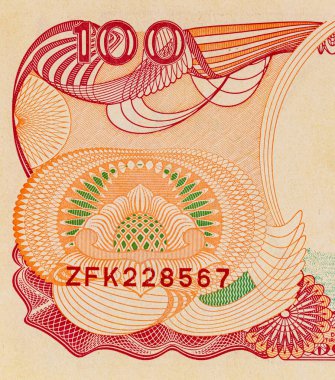 100 rupilik bir Endonezya banknotunun parçası. Endonezya 'nın kağıt parası.