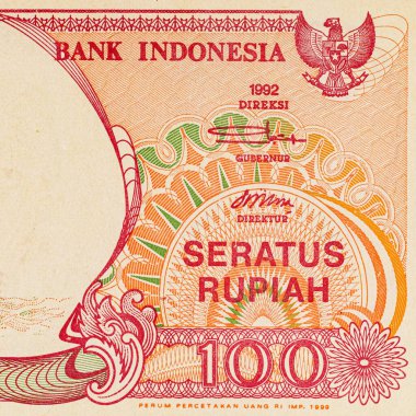 Endonezya 'dan gelen 100 rupiah banknotunun bir parçası, Pinisi Teknesi' ni resmediyor. Endonezya 'dan kağıt para.