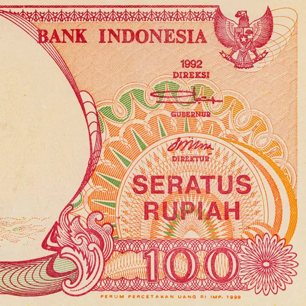 100 rupilik bir Endonezya banknotunun parçası. Endonezya 'nın kağıt parası.