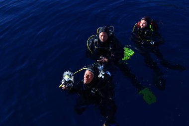 May 24, 2017 - Tuscany, Italy: Group of divers on the surface of the water