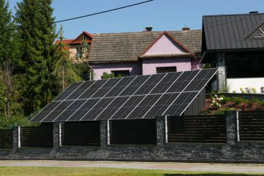 houses and solar panels on the street clipart