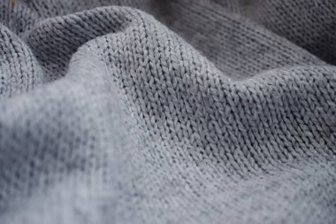 Örülmüş doku arka planı. Dalgalı kumaşı katlar. Arkaplan için makro fotoğraf tekstil dokusu.