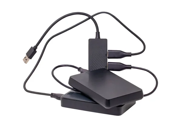 stock image Two large capacity external hard drives connected via USB cable to a 4-port USB distributor isolated on white background. Clipping path. Connect to laptop for backing up files