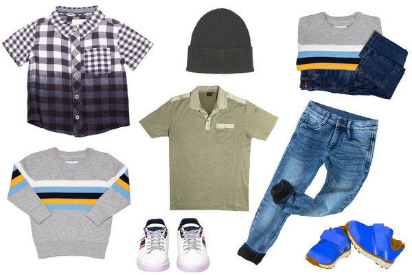Collage set of little boys spring clothes isolated on a white background. Denim trousers or pants, a pair of shoes, sneaker, cap, shirts and jumpers for child boy. Children's autumn and winter fashion.