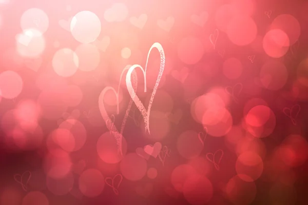 Abstract festive blur bright red pastel background with light pink hearts inside love bokeh for wedding card or Valentine day.  Romantic textured backdrop with space for your design. Card concept.