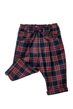 Summer shorts isolated. Close-up of a stylish fashionable plaid short pants with elastic and bow. Clipping path.Tartan checkered fabric texture background.