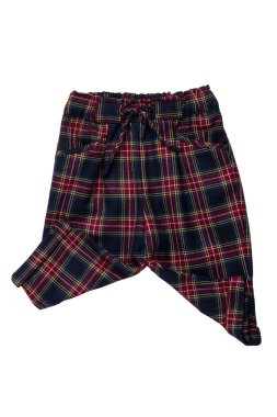 Summer shorts isolated. Close-up of a stylish fashionable plaid short pants with elastic and bow. Clipping path.Tartan checkered fabric texture background.