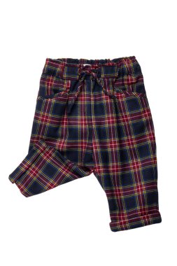 Summer shorts isolated. Close-up of a stylish fashionable plaid short pants with elastic and bow. Clipping path.Tartan checkered fabric texture background.