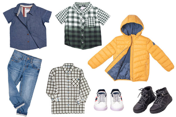 Collage set of little boys spring clothes isolated on a white background. Denim trousers or pants, a pair of shoes, sneaker, cap, shirts and jacket for child boy. Children's autumn and winter fashion.