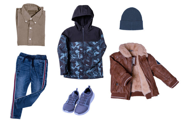 Collage set of little boys autumn clothes isolated. Denim trousers and jacket, sneaker, a leather jacket, pants and hood for child boy. Children's winter fashion.