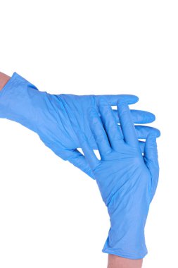 Mavi elbiseli kadın doktor eldivenleri ya da beyaz arka planda izole edilmiş ameliyat eldivenleri. Kişisel koruma ekipmanları.