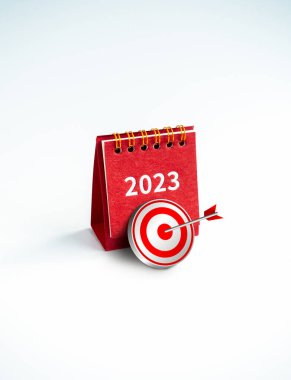 2023 yılınız kutlu olsun. 3D hedef simgesi, kırmızı 2023 yıllık masa numarası takvime göre kırmızı kapak rengi beyaz arka planda dikey şekilde duruyor. İş hedefleri ve başarı kavramları.