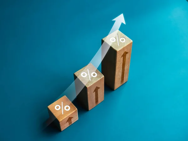 Shining rise up arrow with percentage icon on wooden blocks, 3d bar graph chart steps on blue background, business growth process, profit, market grow, leader trends, economic improvement concepts.
