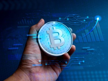 Bitcoin, elinde teknolojik grafikler, iş büyüme grafiği, mavi siber uzay üzerine küresel simge, engelleme zinciri arka planı, gelecekteki finansal, kripto para birimi, yatırım teknolojisi kavramları olan dijital varlıklar.