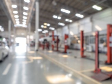 Abstract blur car garage automobile interior. Blurred mechanic service centre auto repair workshop, soft defocused. Blurry car care station background.