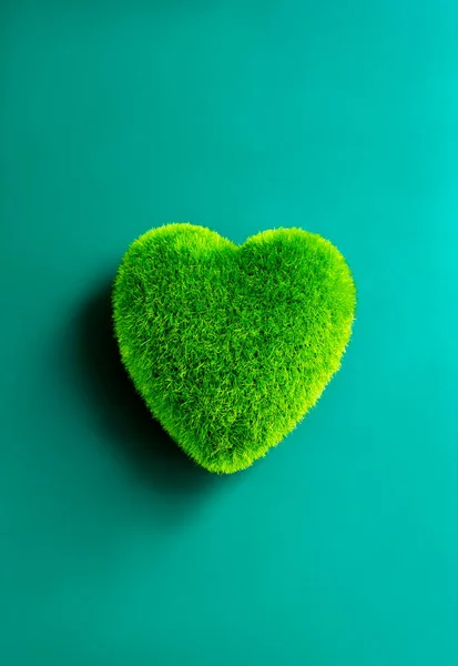 Green heart ball isolated on blue background. Green grass heart shape, green love, vertical style. Environment and sustainable planet protection, Eco-friendly, world care, and Happy Earth Day concept.