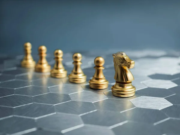The golden horse, knight chess piece standing front of gold pawn chess pieces on silver hexagon pattern board background. Leadership, follower, team, commander, competition, business strategy concept.