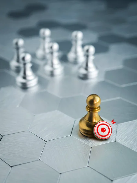 3d target icon with golden pawn standing out from the group of silver pawn chess pieces on hexagon pattern background, stand out from the crowd. Leadership, goal, influencer, difference concept.