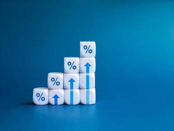 Rise up arrow on white cube blocks, bar graph chart steps with percentage icon isolated on blue background. Business growth process, profit, wealth, leader trends, economic improvement concepts.