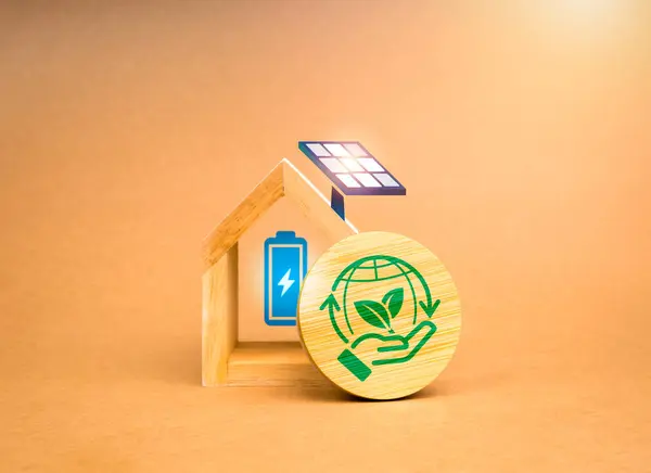 Sustainability at Home, earth care, environment responsibility concepts. Green hand hold world, symbol on round wooden blocks and white house with solar panel and battery on recycle paper background.