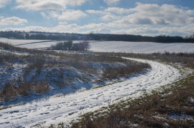 Winter landscape with country road covered with snow near Ivashkove village, Dniproperovsk oblast, Ukrain