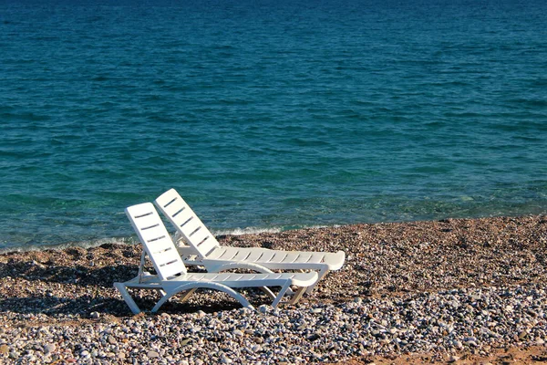 Two beach chairs at the Konyaalti beach in Antalya, Turkey