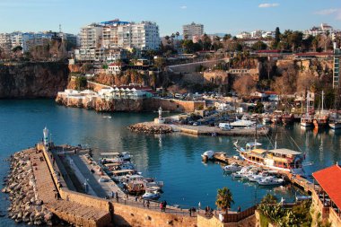 Antalya, Turkey - February 9, 2022: Historical yacht marina and port in Kaleici Old Town of Antalya, a popular resort city and tourist destination 